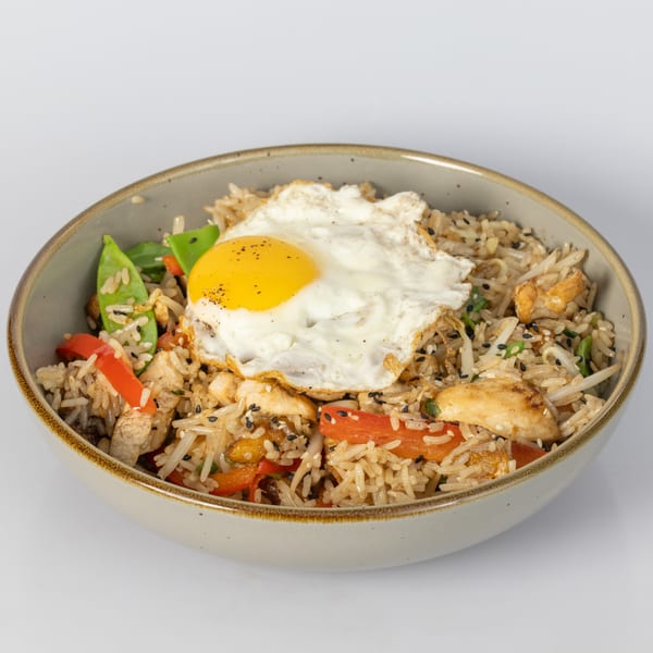 Bocas House's Latin-American fried rice with chicken, vegetables, and a sunny-side-up egg.