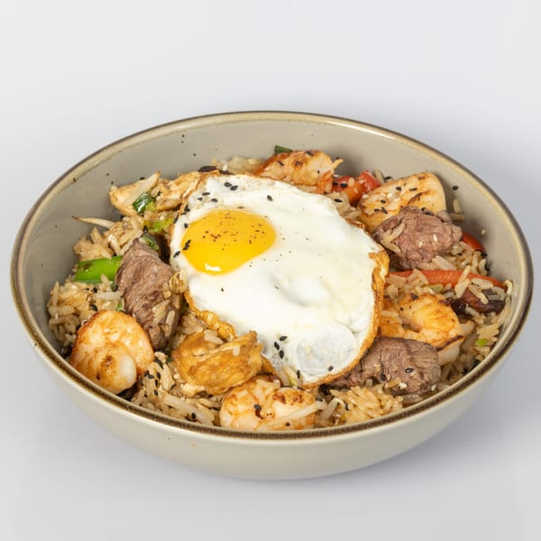 Bocas House's Latin-American fried rice with beef, chicken, shrimp, and a sunny-side-up egg.
